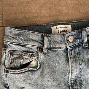 Reformation skinny jeans with rips at knee
